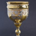 Hand engraving a golden goblet