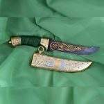 Exclusive handmade knife for the UAE. Green hilt and golden scabbard with falcon