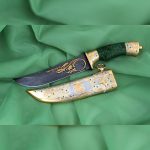 UAE arab knife with a gold falcon on a sheath