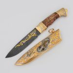Luxurious knife - scorpion. Gold scabbard decorated with carved scorpion, below is the sign of a zadiak.