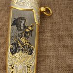 Hand drawing of an eagle on the sheath of a luxury knife