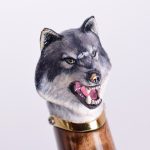 Art decoration of a hilt of a knife with a wolf's head