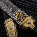 The inscription "Zlatoust" in Russian on a blade of Damascus steel. Jewelery Weapon