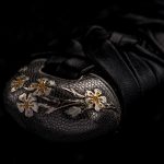 Katana hilt stylized as snake skin coated with precious metal - rhodium