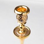 Golden candelabra for one candle