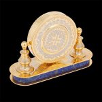 Round office clock in gold on the basis of natural lapis lazuli