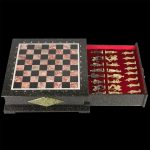 Handmade stone chess include a casket for storing pieces. On the lid, there is a playing field of red and black stone. The casket has an impressive mass of up to 30 kilograms.