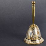 Golden table bell. Interior decoration item