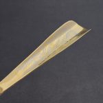 Shoe spoon covered with gold and engraving. Decorating your home