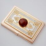 Gold card holder decorated with natural stone
