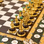 chess pieces with gold and natural stones