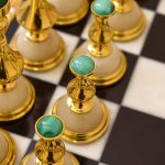 chess pieces with gold and natural stones