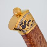Wooden knife handle with gold trim