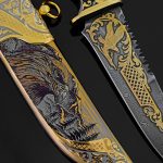 Damascus steel blade with golden ornament