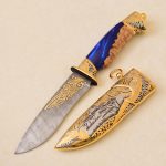 Damascus steel knife with resin handle and gold sheath