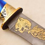 damascus steel embellished with golden panther pattern