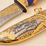 African savannah on a golden scabbard