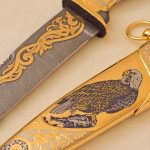 drawing of a hawk on a golden scabbard