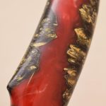 knife handle made of red resin and wood