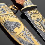 Damascus steel knife with gold ornaments and falcon scabbard