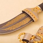Damascus steel blade with gold ornamentation