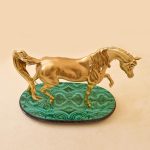 horse figurine in gold color