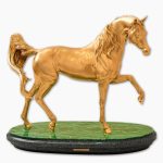 gold horse on stand