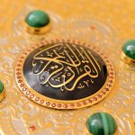 Gold Arabic calligraphy on black enamel, decorative zirconia and natural malachite