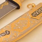 Knife with gold engraving