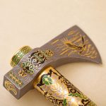 Enamelled Damascus steel ax