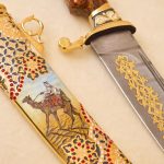 buy a gold knife with a drawing of a traveler in the desert